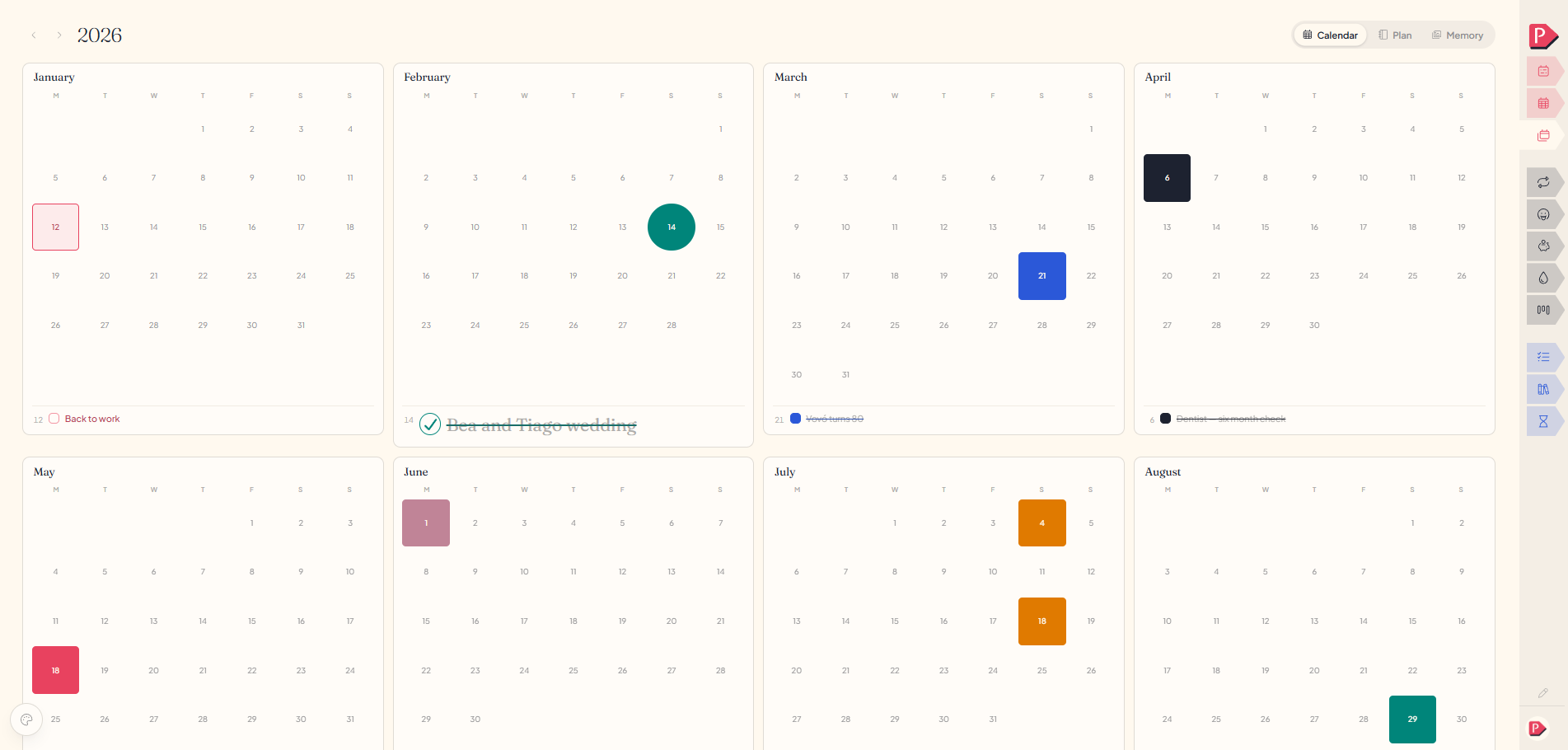 The year calendar at a desk, twelve mini months with a few dates marked and a short list under each